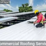 Commercial roofing services team installing energy-efficient roof