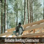 Reliable Roofing Contractor: Smart Tips to Hire Right and Avoid Scams - Your Source for the Latest Housing Trends | Housing Market News| Skilled reliable roofing contractor using hand saw during roof repair work.