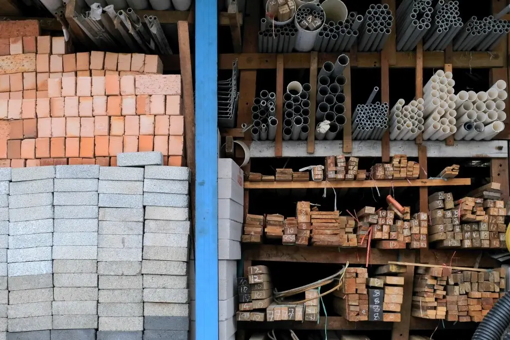 Civil construction materials including concrete, steel, wood, asphalt, and modern building supplies used in infrastructure projects