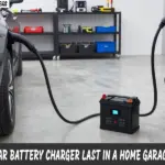 Car battery charger connected to a car battery in a home garage