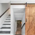 Bespoke pocket doors sliding into wall for compact interiors