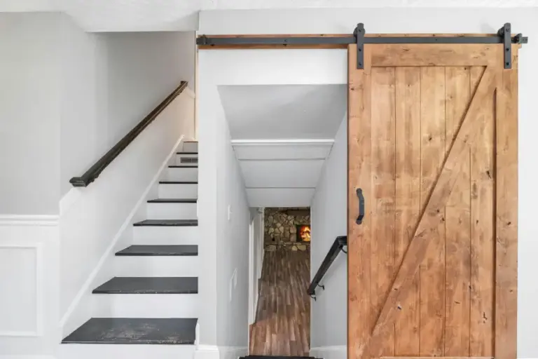 Bespoke pocket doors sliding into wall for compact interiors