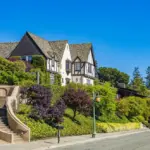 well maintained house exterior with clean siding roof and landscaped yard