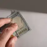 Person applying for cash advance loans online for emergency expenses for home repairs