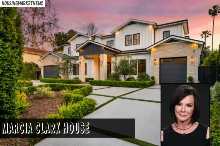 Marcia Clark luxury home front view with landscaped driveway