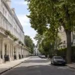 A quiet street of white stucco townhouses in one of London's most expensive neighbourhoods