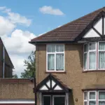A semi-detached house with bay windows on a UK residential street