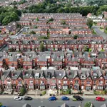 Aerial view of a row of terraced houses in a UK city