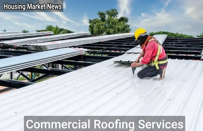 Commercial roofing services team installing energy-efficient roof